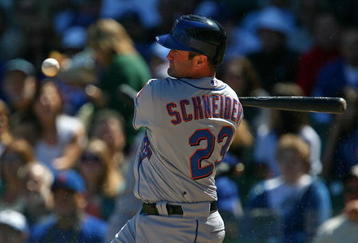 CHICAGO - AUGUST 30: Brain Schneider #23 of the New York Mets looks at the ball after fouling off a pitch against the Chicago Cubs on August 30, 2009 at Wrigley Field in Chicago, Illinois. The Mets defeated the Cubs 4-1. (Photo by Jonathan Daniel/Getty Images)