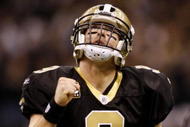NEW ORLEANS - NOVEMBER 30: Quarterback Drew Brees #9 of the New Orleans Saints celebrates after a touchdown against the New England Patriots at Louisana Superdome on November 30, 2009 in New Orleans, Louisiana.  (Photo by Chris Graythen/Getty Images)