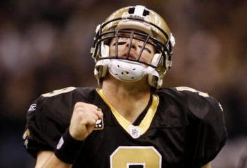 NEW ORLEANS - NOVEMBER 30: Quarterback Drew Brees #9 of the New Orleans Saints celebrates after a touchdown against the New England Patriots at Louisana Superdome on November 30, 2009 in New Orleans, Louisiana.  (Photo by Chris Graythen/Getty Images)