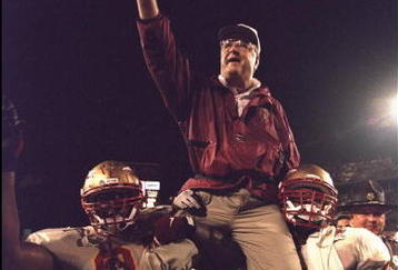 1 Jan 1996:  Head coach Bobby Bowden of the Florida State Seminoles is carried triumphantly off the field by nose guard Andre Wadsworth #8 and tackle Orpheus Roy after defeating the Notre Dame Fighting Irish in the Orange Bowl in Miami, Florida 31-26.  Ma