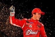 HAMPTON, GA - SEPTEMBER 06:  Kasey Kahne, driver of the #9 Budweiser Dodge, celebrates after winning the NASCAR Sprint Cup Series Pep Boys Auto 500 at Atlanta Motor Speedway on September 6, 2009 in Hampton, Georgia.  (Photo by Jason Smith/Getty Images for NASCAR)