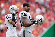 KANSAS CITY, MO - SEPTEMBER 20:  Defensive end Richard Seymour #92 of the Oakland Raiders walks onto the field with Nnamdi Asomugha #21 during the game against the Kansas City Chiefs at Arrowhead Stadium on September 20, 2009 in Kansas City, Missouri.  (Photo by Jamie Squire/Getty Images)