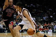 MILWAUKEE - NOVEMBER 30: Andrew Bogut #6 of the Milwuakee Bucks drives around Joakim Noah #13 of the Chicago Bulls at the Bradley Center on November 30, 2009 in Milwaukee, Wisconsin. The Bucks defeated the Bulls 99-97. NOTE TO USER: User expressly acknowledges and agrees that, by downloading and/or using this Photograph, User is consenting to the terms and conditions of the Getty Images License Agreement. (Photo by Jonathan Daniel/Getty Images)