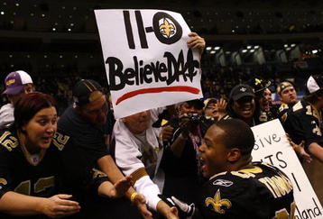 NEW ORLEANS - NOVEMBER 30: Pierre Thomas #23 of the New Orleans Saints celebrates with fans after their 38-17 win over the New England Patriots at Louisana Superdome on November 30, 2009 in New Orleans, Louisiana. (Photo by Scott Halleran/Getty Images)