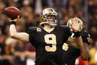 NEW ORLEANS - NOVEMBER 30: Quarterback Drew Brees #9 of the New Orleans Saintsthrows a 2-yard touchdown pass in the third quarter against the New England Patriots at Louisana Superdome on November 30, 2009 in New Orleans, Louisiana. (Photo by Scott Halleran/Getty Images)