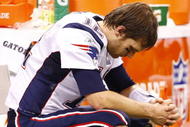 NEW ORLEANS - NOVEMBER 30: Quarterback Tom Brady #12 of the New England Patriots sits dejected on the bench late in the fourth quarter against the New Orleans Saints at Louisana Superdome on November 30, 2009 in New Orleans, Louisiana. (Photo by Scott Halleran/Getty Images)