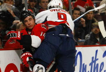 OTTAWA, ON - NOVEMBER 23:  Alex Ovechkin #8 of the Washington Capitals takes a roughing penalty for this high hit on Chris Campoli #14 of the Ottawa Senators in a game at Scotiabank Place on November 23, 2009 in Ottawa, Canada. (Photo by Phillip MacCallum/Getty Images)