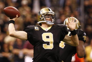 NEW ORLEANS - NOVEMBER 30: Quarterback Drew Brees #9 of the New Orleans Saintsthrows a 2-yard touchdown pass in the third quarter against the New England Patriots at Louisana Superdome on November 30, 2009 in New Orleans, Louisiana. (Photo by Scott Halleran/Getty Images)