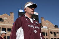 BOULDER, CO - NOVEMBER 07:  Head coach Mike Sherman of the Texas A&M Aggies enters the field for the second half as he leads his team against the Colorado Buffaloes during NCAA college football action at Folsom Field on November 7, 2009 in Boulder, Colorado. Colorado defeated Texas A&M 35-34.  (Photo by Doug Pensinger/Getty Images)