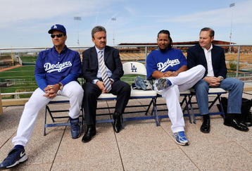 GLENDALE, AZ - MARCH 05:  Manny Ramirez #99 (2R) of the Los Angeles Dodgers manager Joe Torre #6 (L) general manager Ned Colletti and Ramirez's agent Scott Boras looks on during a news conference on March 5, 2009, at Camelback Ranch in Glendale, Arizona, after he re-signed with the Dodgers.  (Photo by Kevork Djansezian/Getty Images)