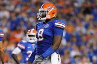 GAINESVILLE, FL - NOVEMBER 7: Defensive end Carlos Dunlap #8 of the Florida Gators sets on defense against the Vanderbilt Commodores on November 7, 2009 at Ben Hill Griffin Stadium in Gainesville, Florida. (Photo by Al Messerschmidt/Getty Images)