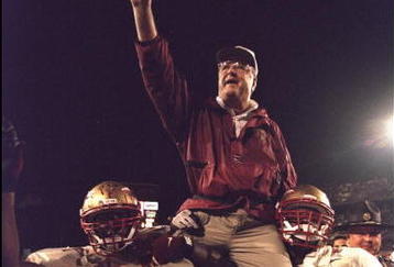 1 Jan 1996:  Head coach Bobby Bowden of the Florida State Seminoles is carried triumphantly off the field by nose guard Andre Wadsworth #8 and tackle Orpheus Roy after defeating the Notre Dame Fighting Irish in the Orange Bowl in Miami, Florida 31-26.  Ma