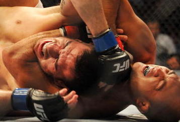 PHILADELPHIA - AUGUST 08:   Lightweight champion BJ Penn (R) battles Kenny Florian during their lightweight championship title bout at UFC 101: Declaration at the Wachovia Center on August 8, 2009 in Philadelphia, Pennsylvania.  (Photo by Jon Kopaloff/Getty Images)