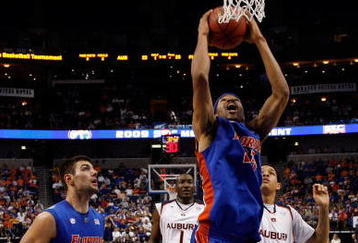 TAMPA, FL - MARCH 13:  Alex Tyus #23 of the Florida Gators dunks the ball over Quantez Robertson #23 of the Auburn Tigers during the quaterfinal round of the SEC Men's Basketball Tournament on March 13, 2009 at The St. Pete Times Forum in Tampa, Florida.  (Photo by Chris Graythen/Getty Images)