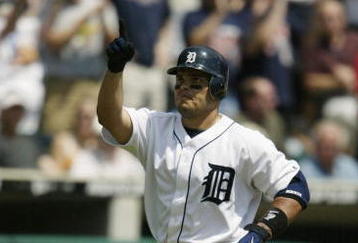 DETROIT - AUGUST 8:  Ivan Rodriguez #7 of the Detroit Tigers points to the sky as he runs to the plate after hitting a solo home run against the Boston Red Sox in the first inning of the game on August 8, 2004 at Comerica Park in Detroit, Michigan.  The Red Sox defeated the Tigers 11-9.  (Photo by Tom Pidgeon/Getty Images)