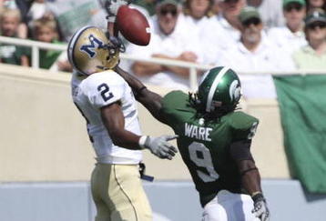 EAST LANSING, MI - SEPTEMBER 05: Defensive back Jeremy Ware #9 of the Michigan State Spartans defends the pass against wide receiver Elvis Akpla #2 of Montana State during the game on September 5, 2009 at Spartan Stadium in East Lansing, Michigan.  (Photo by Leon Halip/Getty Images)
