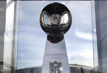 GLENDALE, AZ - JANUARY 26:  The Vince Lombardi Trophy was brought in by NFL Security and put on display.  Football fans take in all the activities during the NFL Experience on January 26, 2008 at University of Phoenix Stadium in Glendale, Arizona. (Photo By Domenic Centofanti/Getty Images)