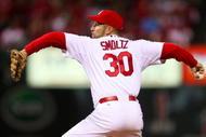 ST. LOUIS, MO - OCTOBER 10:  Pitcher John Smoltz#30 of the St. Louis Cardinals delivers a pitch against the Los Angeles Dodgers in the sixth inning of Game Three of the NLDS during the 2009 MLB Playoffs at Busch Stadium on October 10, 2009 in St. Louis, Missouri. (Photo by Dilip Vishwanat/Getty Images)