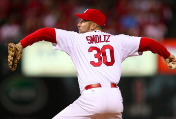 ST. LOUIS, MO - OCTOBER 10:  Pitcher John Smoltz#30 of the St. Louis Cardinals delivers a pitch against the Los Angeles Dodgers in the sixth inning of Game Three of the NLDS during the 2009 MLB Playoffs at Busch Stadium on October 10, 2009 in St. Louis, Missouri. (Photo by Dilip Vishwanat/Getty Images)