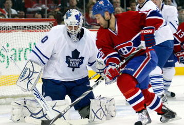 MONTREAL- DECEMBER 1:  Jonas Gustavsson #50 of the Toronto Maple Leafs gets down to stop the puck on an attempt by Glen Metropolit #15 of the Montreal Canadiens during the NHL game on December 1, 2009 at the Bell Centre in Montreal, Quebec, Canada.  (Photo by Richard Wolowicz/Getty Images)