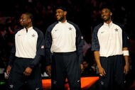 PHOENIX - FEBRUARY 15:  (L-R) Dwyane Wade, LeBron James and Kobe Bryant, members of the women's and men's gold medal winning USA Olympic basketball teams, wave to the crowd during half time of the 58th NBA All-Star Game, part of 2009 NBA All-Star Weekend at US Airways Center on February 15, 2009 in Phoenix, Arizona.  NOTE TO USER: User expressly acknowledges and agrees that, by downloading and or using this photograph, User is consenting to the terms and conditions of the Getty Images License Agreement.  (Photo by Ronald Martinez/Getty Images)