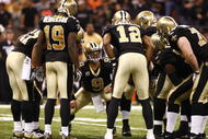 NEW ORLEANS - NOVEMBER 30: Quarterback Drew Brees #9 of the New Orleans Saintscalls a play in the offensive huddle against the New England Patriots at Louisana Superdome on November 30, 2009 in New Orleans, Louisiana. (Photo by Scott Halleran/Getty Images)