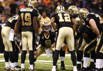 NEW ORLEANS - NOVEMBER 30: Quarterback Drew Brees #9 of the New Orleans Saintscalls a play in the offensive huddle against the New England Patriots at Louisana Superdome on November 30, 2009 in New Orleans, Louisiana. (Photo by Scott Halleran/Getty Images)