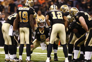 NEW ORLEANS - NOVEMBER 30: Quarterback Drew Brees #9 of the New Orleans Saintscalls a play in the offensive huddle against the New England Patriots at Louisana Superdome on November 30, 2009 in New Orleans, Louisiana. (Photo by Scott Halleran/Getty Images)