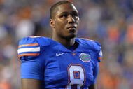 GAINESVILLE, FL - NOVEMBER 7: Defensive end Carlos Dunlap #8 of the Florida Gators sets on defense against the Vanderbilt Commodores on November 7, 2009 at Ben Hill Griffin Stadium in Gainesville, Florida. (Photo by Al Messerschmidt/Getty Images)