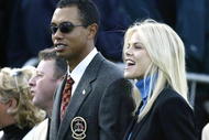 SUTTON COLDFIELD - SEPTEMBER 26:  Golfer Tiger Woods poses with girlfriend Elin Nordegren during the opening Ceremony for the 34th Ryder Cup on September 26, 2002 in Sutton Coldfield, England. (Photo by Andrew Redington/Getty Images)