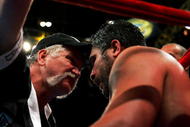 NEW YORK - APRIL 30:  John Ruiz' trainer Norman Stone (L) talks to Ruiz in his corner during his WBA Heavyweight Championship bout against James Toney at Madison Square Garden on April 30, 2005 in New York City.  (Photo by Chris Trotman/Getty Images)