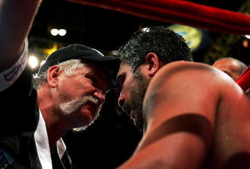 NEW YORK - APRIL 30:  John Ruiz' trainer Norman Stone (L) talks to Ruiz in his corner during his WBA Heavyweight Championship bout against James Toney at Madison Square Garden on April 30, 2005 in New York City.  (Photo by Chris Trotman/Getty Images)