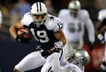 ARLINGTON, TX - NOVEMBER 26:  Wide receiver Miles Austin #19 of the Dallas Cowboys is tackled by Chris Johnson #37 of the Oakland Raiders at Cowboys Stadium on November 26, 2009 in Arlington, Texas.  (Photo by Ronald Martinez/Getty Images)