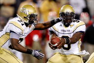 ATLANTA - NOVEMBER 28:  Jonathan Dwyer #21 and quarterback Josh Nesbitt #9 of the Georgia Tech Yellow Jackets against the Georgia Bulldogs at Bobby Dodd Stadium on November 28, 2009 in Atlanta, Georgia.  (Photo by Kevin C. Cox/Getty Images)