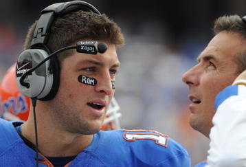 GAINESVILLE, FL - NOVEMBER 21: Quarterback Tim Tebow #15 of the Florida Gators talks with coach Urban Meyer against the Florida International University Golden Panthers, November 21, 2009 at Ben Hill Griffin Stadium in Gainesville, Florida.  (Photo by Al Messerschmidt/Getty Images)
