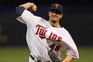 MINNEAPOLIS - OCTOBER 11: Carl Pavano #48 of the Minnesota Twins delivers the ball against the New York Yankees in Game Three of the ALDS during the 2009 MLB Playoffs at the Hubert H. Humphrey Metrodome on October 11, 2009 in Minneapolis, Minnesota. (Photo by Jonathan Daniel/Getty Images)