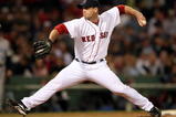 BOSTON - SEPTEMBER 29:  Billy Wagner #13 of the Boston Red Sox delivers a pitch in the eighth inning against the Toronto Blue Jays on September 29, 2009 at Fenway Park in Boston, Massachusetts.  (Photo by Elsa/Getty Images)