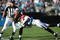 CHARLOTTE, NC - NOVEMBER 15:  Brent Grimes #20 of the Atlanta Falcons tackles Steve Smith #89 of the Carolina Panthers during their game at Bank of America Stadium on November 15, 2009 in Charlotte, North Carolina.  (Photo by Streeter Lecka/Getty Images)