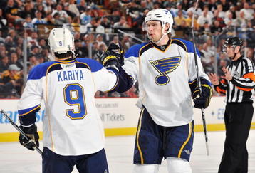 PITTSBURGH - OCTOBER 20: Patrik Berglund #21of the St. Louis Blues congratulates teammate Paul Kariya #9 after Kariya scored a goal against the Pittsburgh Penguins in the second period on October 20, 2009 at Mellon Arena in Pittsburgh, Pennsylvania. Berglund assisted on the goal.  (Photo by Jamie Sabau/Getty Images)