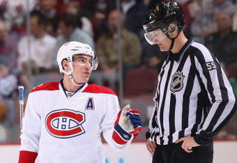 GLENDALE, AZ - NOVEMBER 12:  Mike Cammalleri #13 of the Montreal Canadiens talks with linesman Shane Heyer during the NHL game against the Phoenix Coyotes at Jobing.com Arena on November 12, 2009 in Glendale, Arizona. The Canadiens defeated the Coyotes 4-2. (Photo by Christian Petersen/Getty Images)