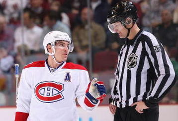 GLENDALE, AZ - NOVEMBER 12:  Mike Cammalleri #13 of the Montreal Canadiens talks with linesman Shane Heyer during the NHL game against the Phoenix Coyotes at Jobing.com Arena on November 12, 2009 in Glendale, Arizona. The Canadiens defeated the Coyotes 4-2. (Photo by Christian Petersen/Getty Images)