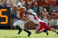 AUSTIN, TX - OCTOBER 27: Vondrell McGee #2 of the Texas Longhorns carries the ball against Ben Tasa #46 of the Nebraska Cornhuskers at Darrell K Royal-Texas Memorial Stadium October 27, 2007 in Austin, Texas. Texas won 28-25. (Photo by Brian Bahr/Getty Images)