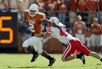 AUSTIN, TX - OCTOBER 27: Vondrell McGee #2 of the Texas Longhorns carries the ball against Ben Tasa #46 of the Nebraska Cornhuskers at Darrell K Royal-Texas Memorial Stadium October 27, 2007 in Austin, Texas. Texas won 28-25. (Photo by Brian Bahr/Getty Images)