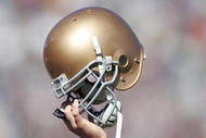 SOUTH BEND, IN - OCTOBER 07:  A member of Notre Dame Fighting Irish holds up his helmet on the opening kickoff during the game against the Stanford Cardinal on October 7, 2006 at Notre Dame Stadium in South Bend, Indiana.  (Photo by Andy Lyons/Getty Images)