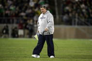 PALO ALTO, CA - NOVEMBER 28:  Notre Dame head coach Charlie Weis walks back to the sideline after speaking to his team during their game against the Stanford Cardinal at Stanford Stadium on November 28, 2009 in Palo Alto, California.  (Photo by Ezra Shaw/Getty Images)