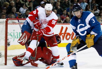 MONTREAL- NOVEMBER 21:  Tomas Holmstrom #96 of the Detroit Red Wings attempts to deflect the puck in front of Carey Price #31 and Ryan O'Byrne #3 of the Montreal Canadiens during the NHL game on November 21, 2009 at the Bell Centre in Montreal, Quebec, Canada.  The Red Wings defeated the Canadiens 3-2 in a shootout.  (Photo by Richard Wolowicz/Getty Images)