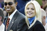 SUTTON COLDFIELD, UK - SEPTEMBER 26:  Golfer Tiger Woods poses with girlfriend Elin Nordegren during the opening ceremony for the 34th Ryder Cup September 26, 2002 in Sutton Coldfield, England. (Photo by Andrew Redington/Getty Images)