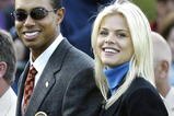 SUTTON COLDFIELD, UK - SEPTEMBER 26:  Golfer Tiger Woods poses with girlfriend Elin Nordegren during the opening ceremony for the 34th Ryder Cup September 26, 2002 in Sutton Coldfield, England. (Photo by Andrew Redington/Getty Images)