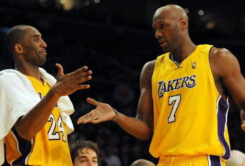 LOS ANGELES, CA - DECEMBER 01:  Lamar Odum #7 of the Los Angeles Lakers is greeted by Kobe Bryant #24 as he leaves the game leading the New Orleans Hornets during the fourth quarter at Staples Center on December 1, 2009 in Los Angeles, California. NOTE TO USER: User expressly acknowledges and agrees that, by downloading and/or using this Photograph, user is consenting to the terms and conditions of the Getty Images License Agreement.  (Photo by Harry How/Getty Images)