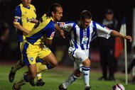 BRIGHTON, ENGLAND - OCTOBER 13: Nicky Forster of Brighton and Hove Albion avoids Josh Gowling of Gillingham during the Coca-Cola League One match between Brighton & Hove Albion and Gillingham at Withdean Stadium on October 13, 2009 in Brighton, England.  (Photo by Bryn Lennon/Getty Images)
